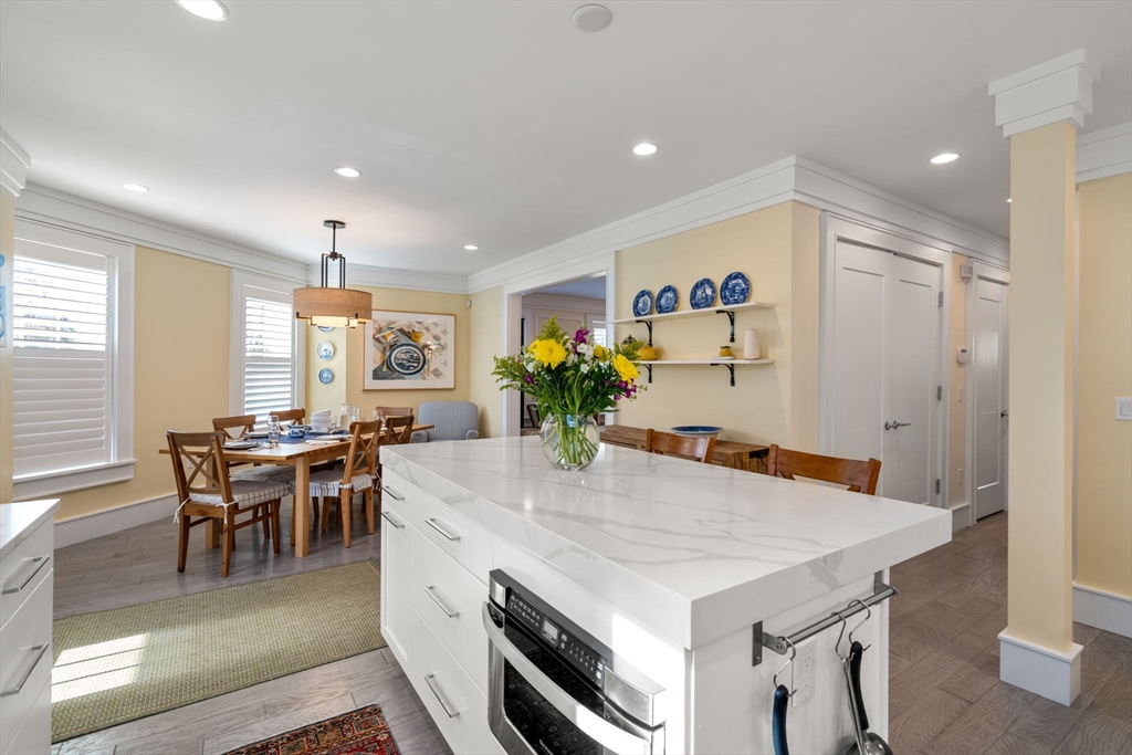1404 Centre Street Newton, MA 02459 - Photo 4 of 42 a view of a dining room with furniture and a potted plant