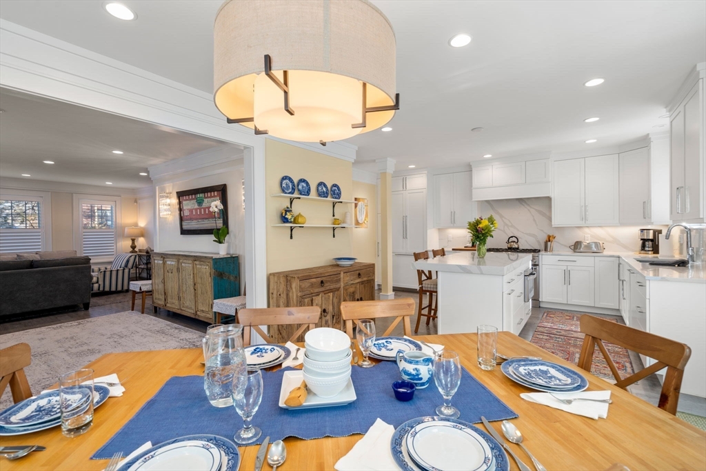 1404 Centre Street Newton, MA 02459 - Photo 10 of 42 a living room with furniture kitchen view and a chandelier