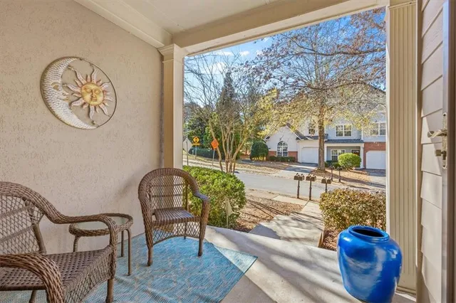 a living room with couch and a large window