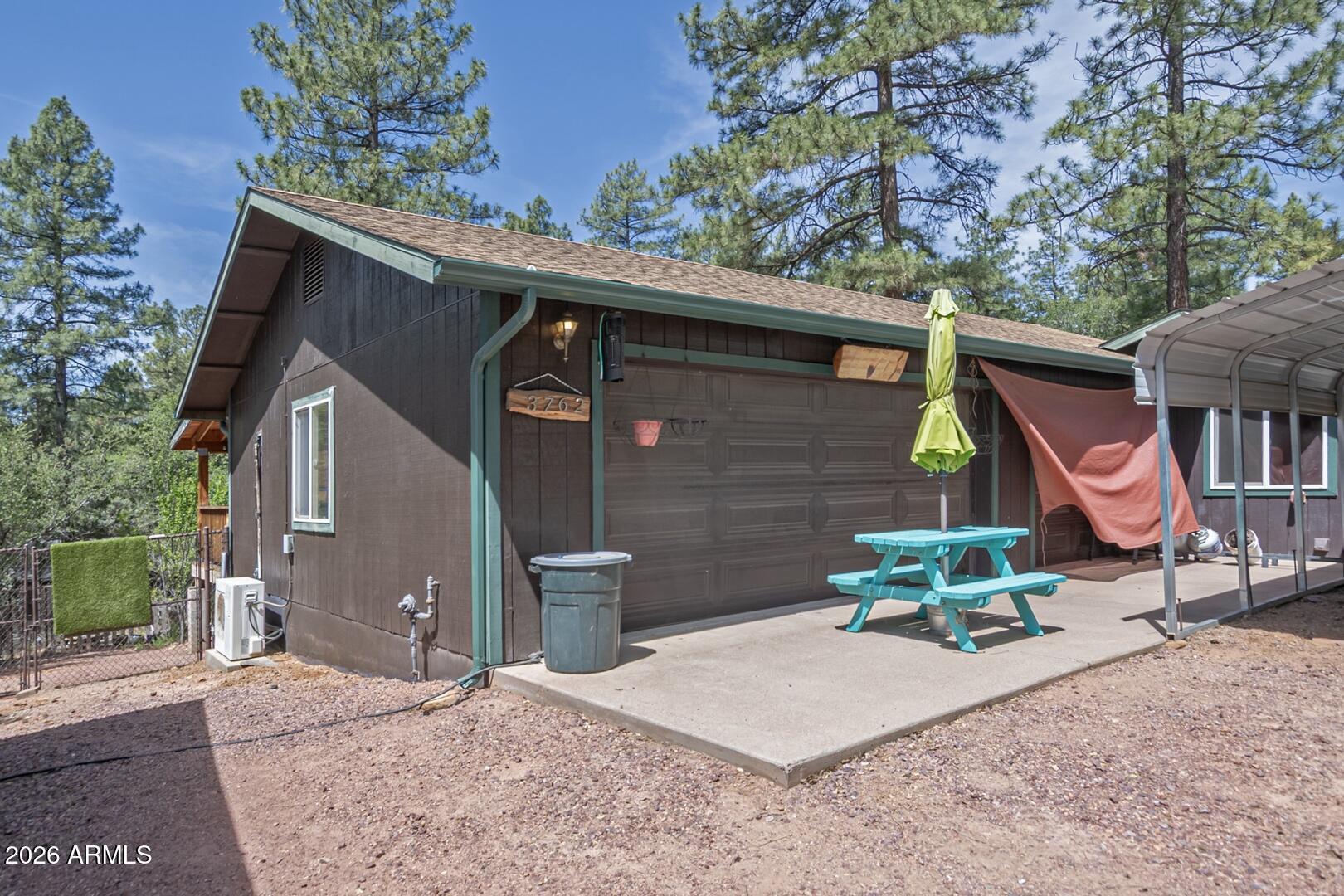 3762 Watertank Road Pine, AZ 85544 - Photo 33 of 38 a front view of a house with a yard