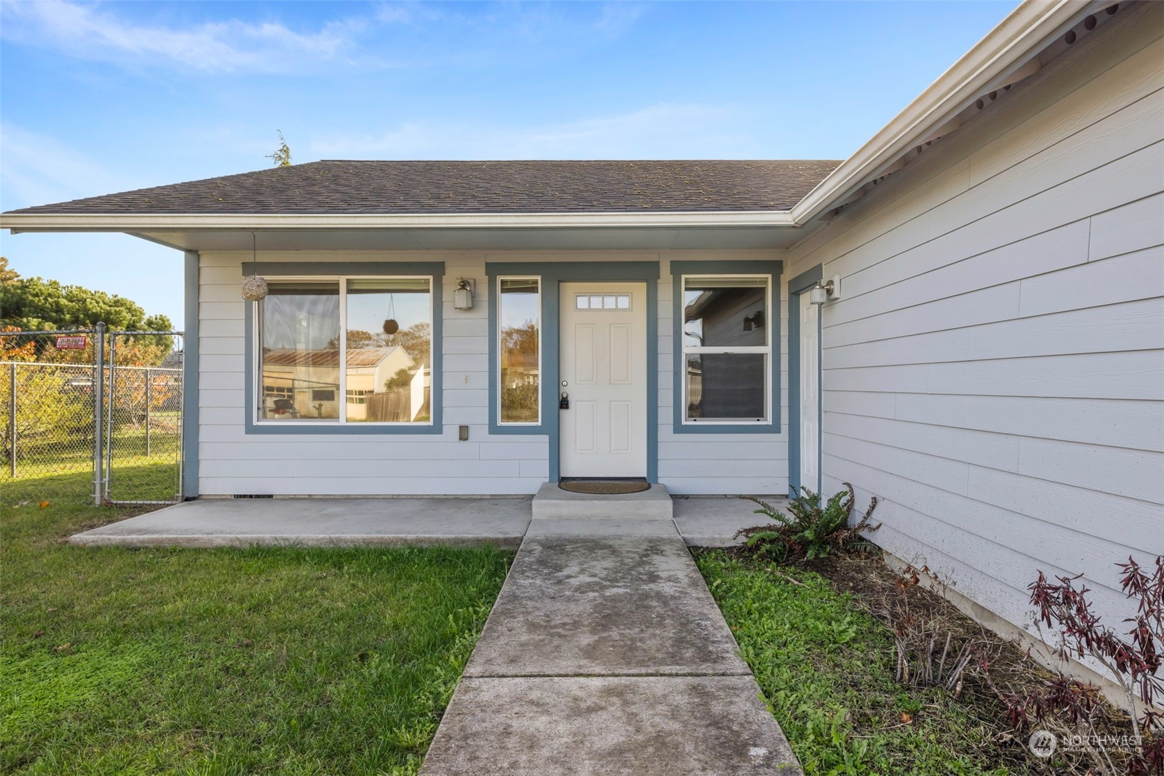 709 East Fir Street Sequim, WA 98382 - Photo 21 of 29 a front view of a house with garden