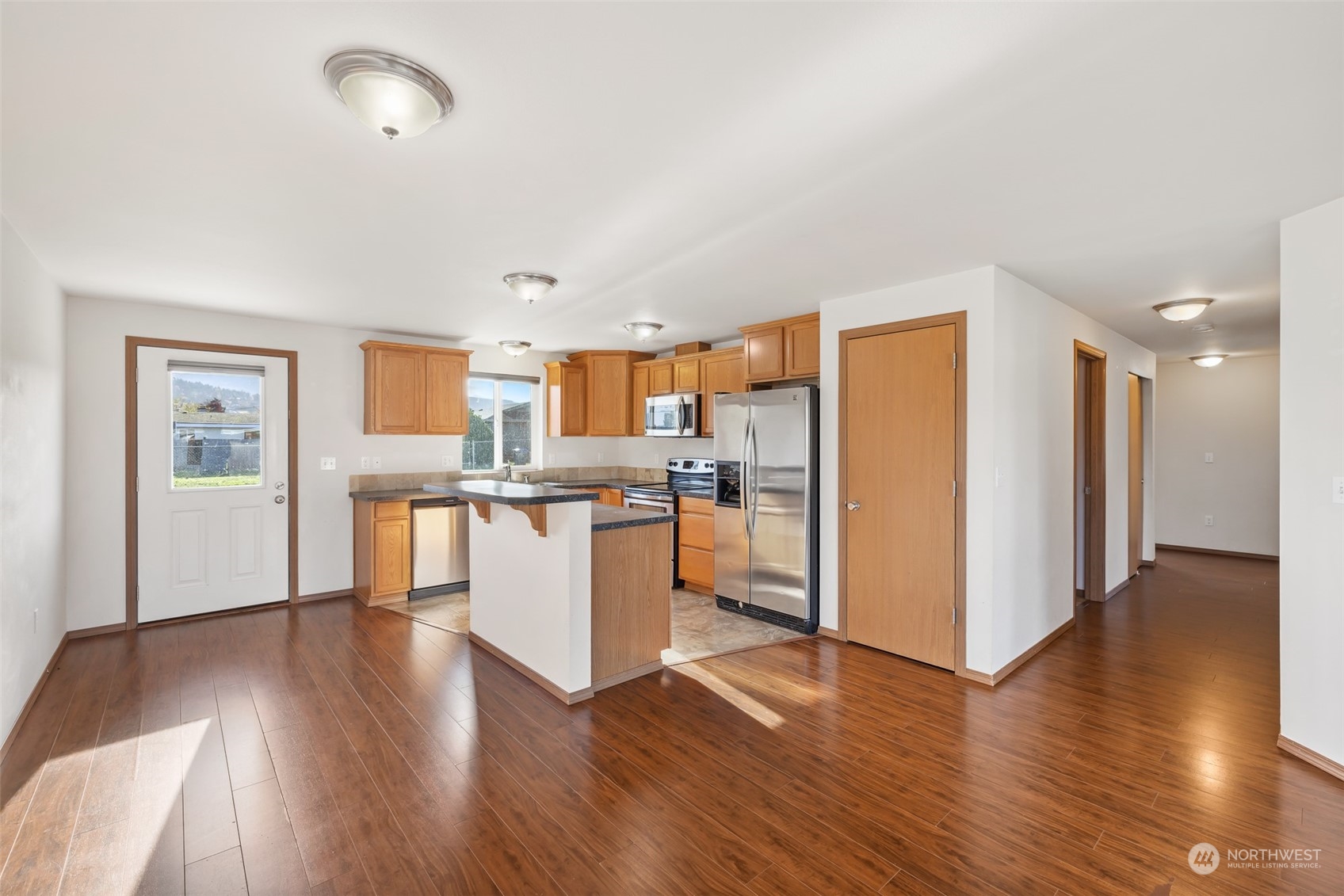709 East Fir Street Sequim, WA 98382 - Photo 7 of 29 a view of kitchen with wooden floor and electronic appliances