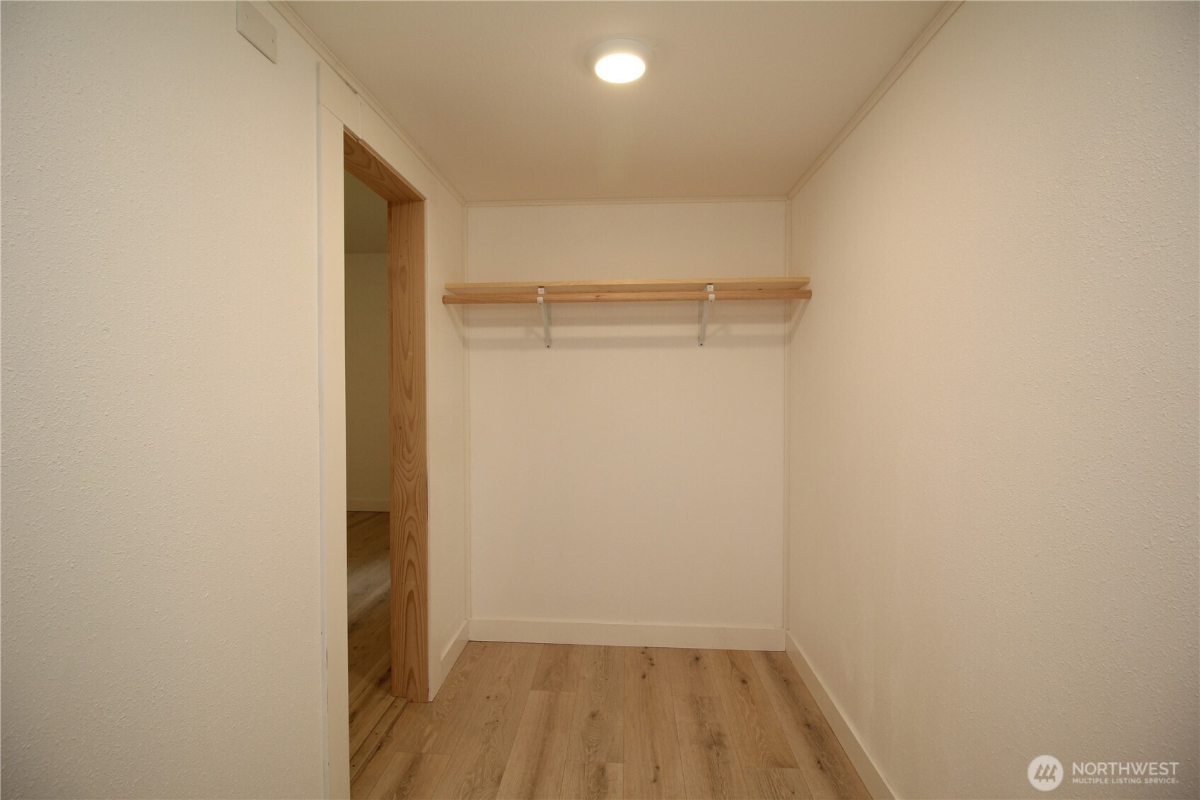10341 184th Avenue Southwest Rochester, WA 98579 - Photo 8 of 36 a view of a room with wooden floor