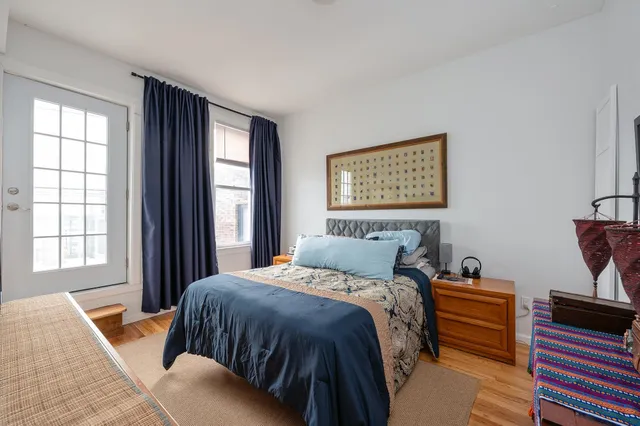 a bed room with a bed and a window