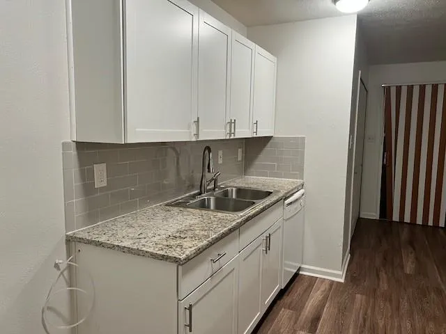 storage and utility room with wooden floor