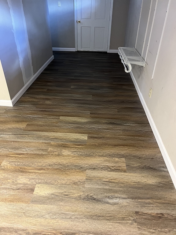 39 Phebe Avenue Lowell, MA 01854 - Photo 12 of 13 a view of an empty room with wooden floor