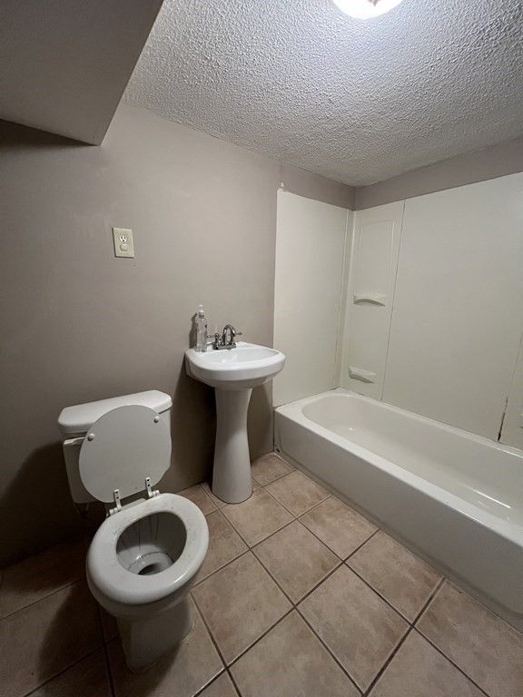 39 Phebe Avenue Lowell, MA 01854 - Photo 6 of 13 a bathroom with a toilet sink and bathtub