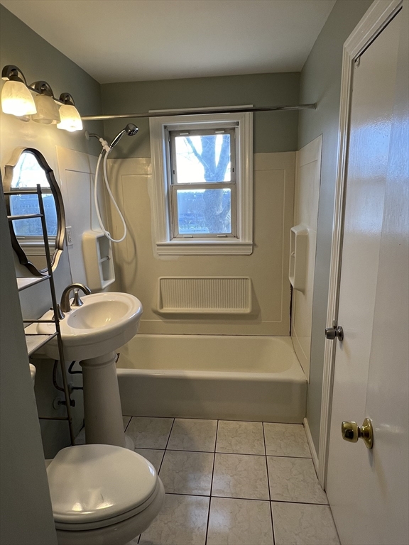 39 Phebe Avenue Lowell, MA 01854 - Photo 9 of 13 a bathroom with a sink a toilet and a bathtub