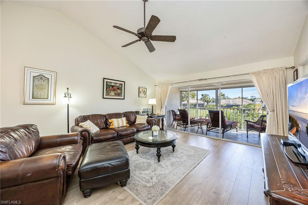 5940 Cranbrook Way, Unit A206 Naples, FL 34112 - Photo 11 of 50 a living room with furniture and a large window