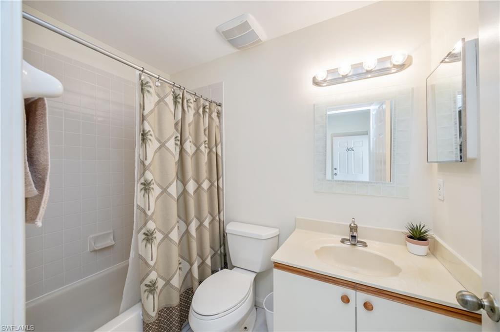 5940 Cranbrook Way, Unit A206 Naples, FL 34112 - Photo 16 of 50 a bathroom with a sink a toilet and shower