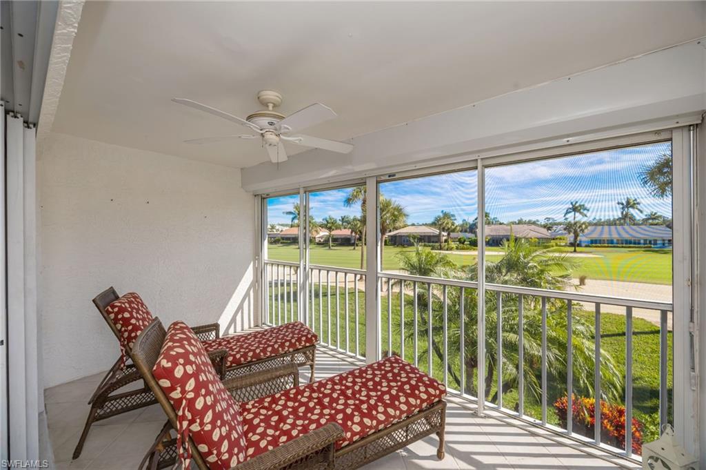 5940 Cranbrook Way, Unit A206 Naples, FL 34112 - Photo 3 of 50 a view of a city from a balcony with furniture