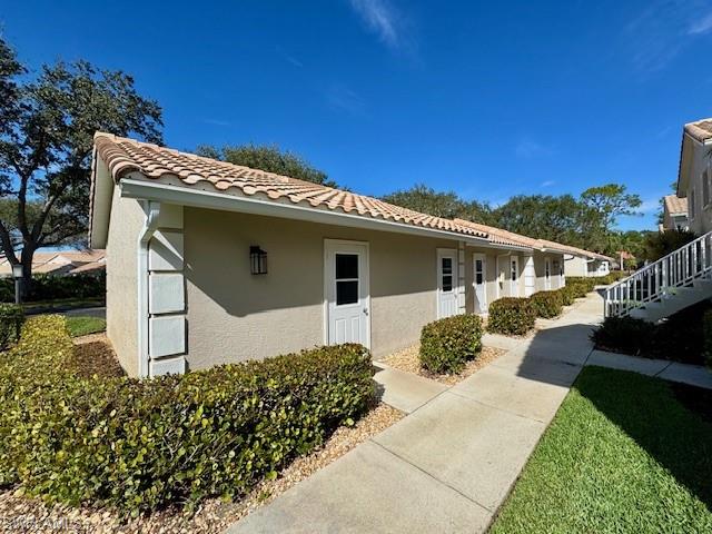 5940 Cranbrook Way, Unit A206 Naples, FL 34112 - Photo 5 of 50 a front view of a house with garden