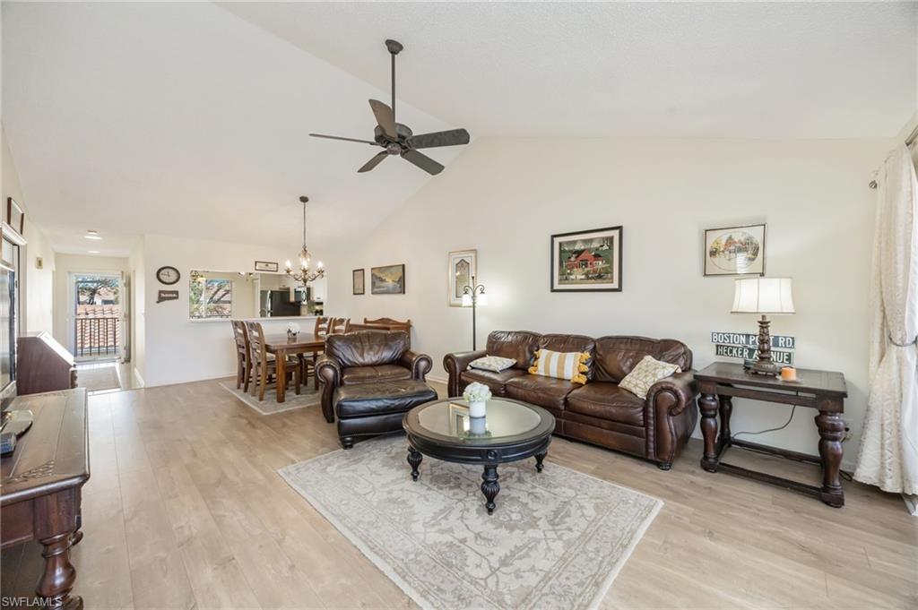 5940 Cranbrook Way, Unit A206 Naples, FL 34112 - Photo 10 of 50 a living room with furniture and a wooden floor