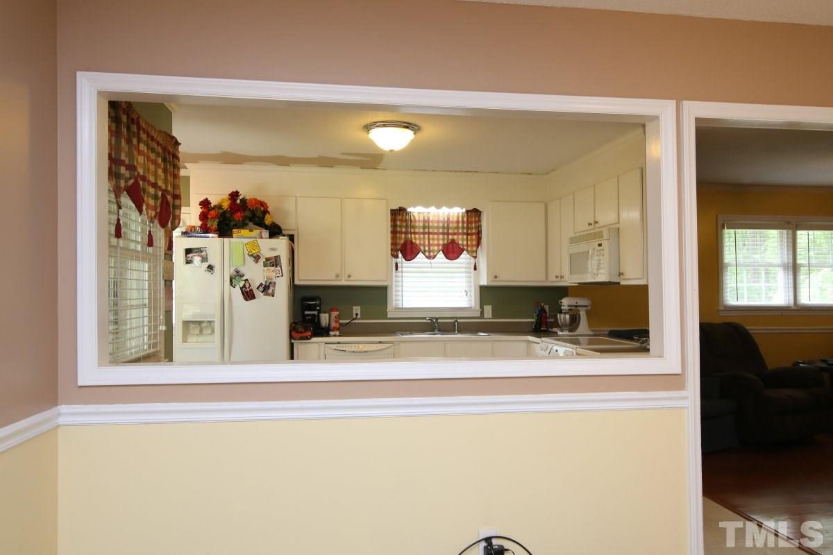1629 Gate 2 Road Creedmoor, NC 27522 - Photo 4 of 22 a view of a living room with furniture and a flat screen tv