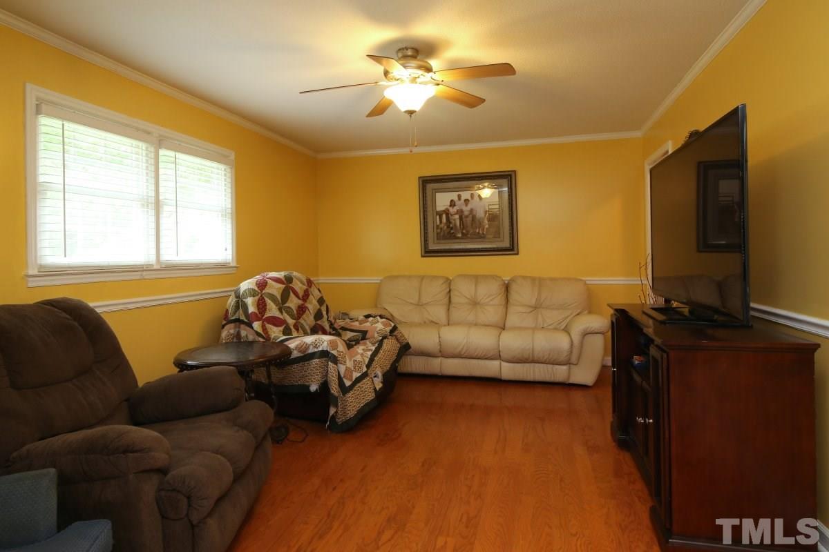 1629 Gate 2 Road Creedmoor, NC 27522 - Photo 7 of 22 a living room with furniture and a flat screen tv