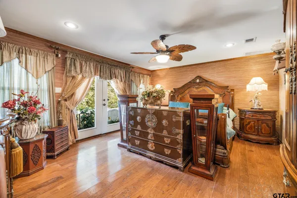 a view of a livingroom with furniture and hardwood floor