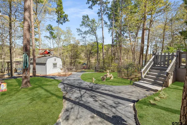 a backyard of a house with lots of green space
