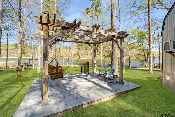 a view of a park with plants and a bench