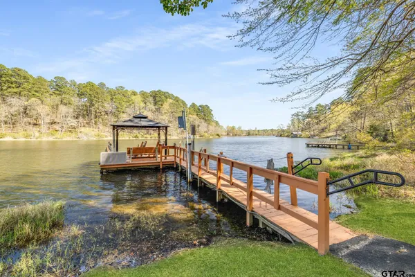 a view of a ocean with boats in the background