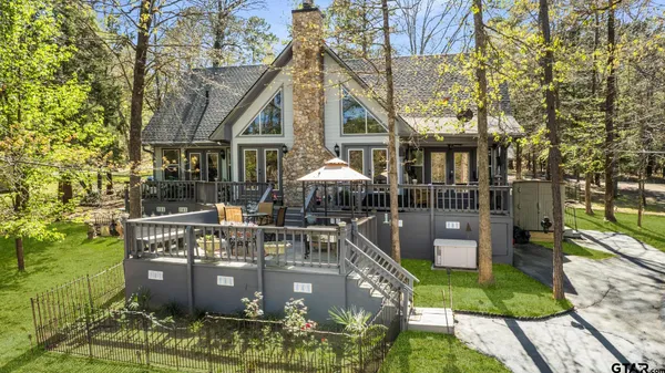 a view of house with yard outdoor seating and entertaining space