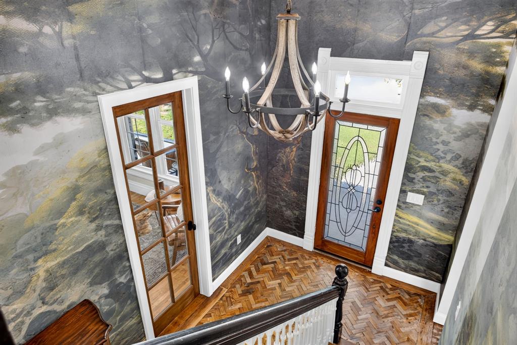 702 West Spring Street Weatherford, TX 76086 - Photo 7 of 39 Entrance foyer featuring herringbone wood-finish flooring and a decorative wood-frame front door with leaded glass