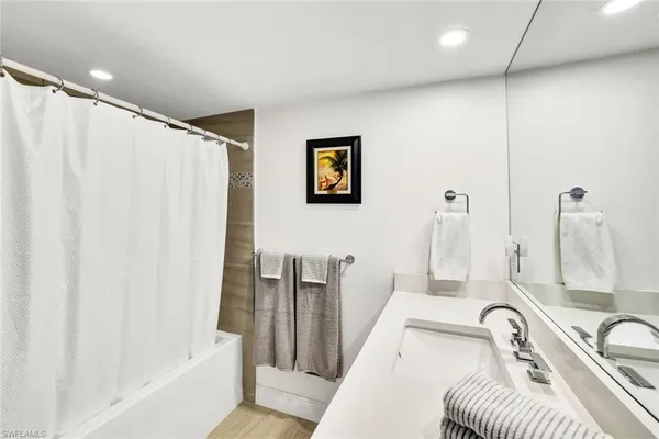 a bathroom with a sink a toilet and a tub