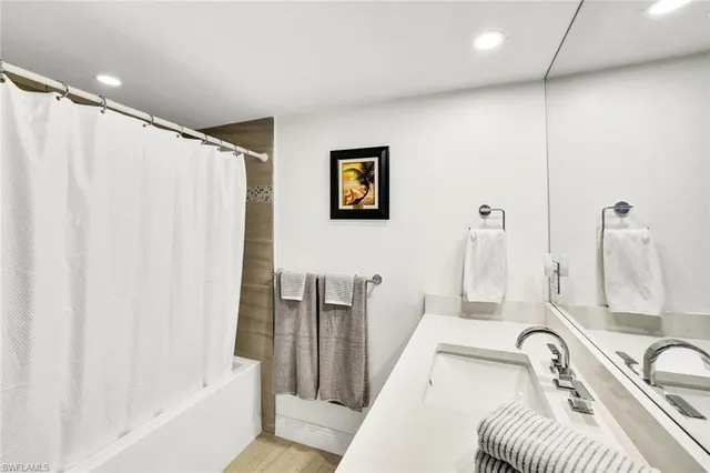 a bathroom with a sink a toilet and a tub