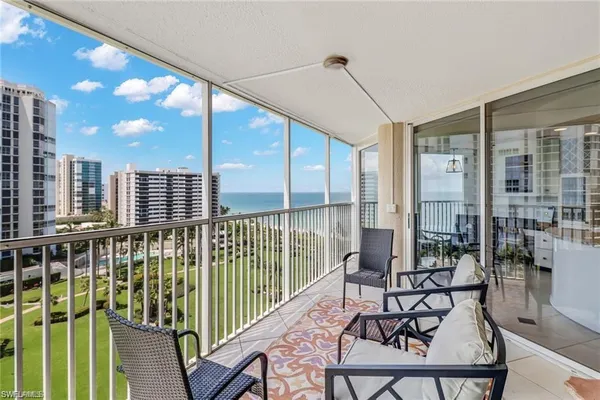 a view of balcony with furniture