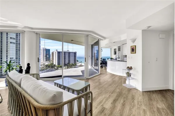 a living room with furniture and a table