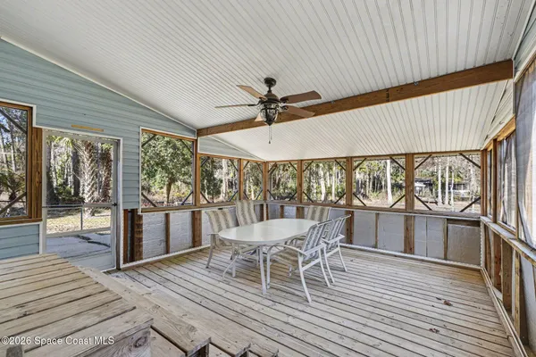 a outdoor space with furniture and wooden floor