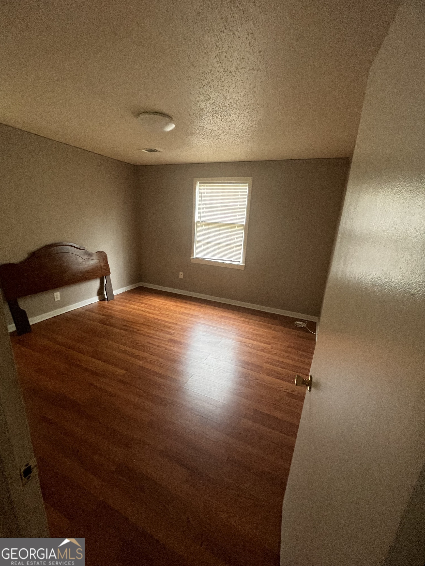 2328 Getzen Street Augusta, GA 30906 - Photo 5 of 10 features reddish-brown wood-look laminate flooring
