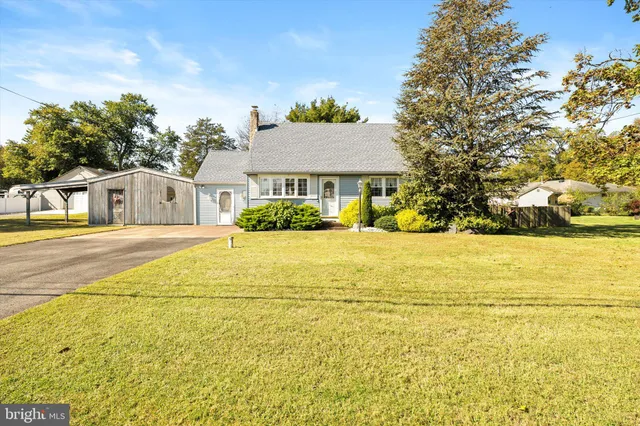 a view of residential houses with yard and swimming pool
