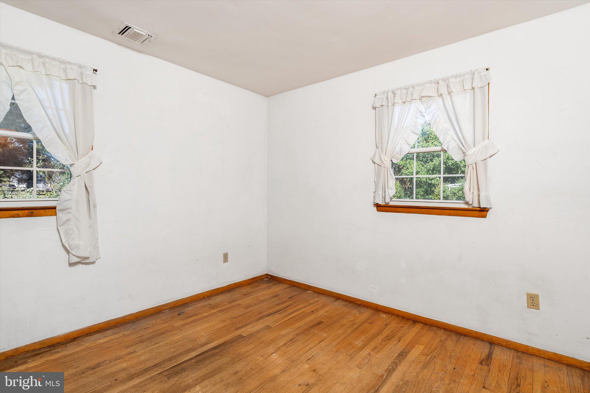 3 Applegate Lane New Egypt, NJ 08533 - Photo 12 of 38 an empty room with wooden floor and windows