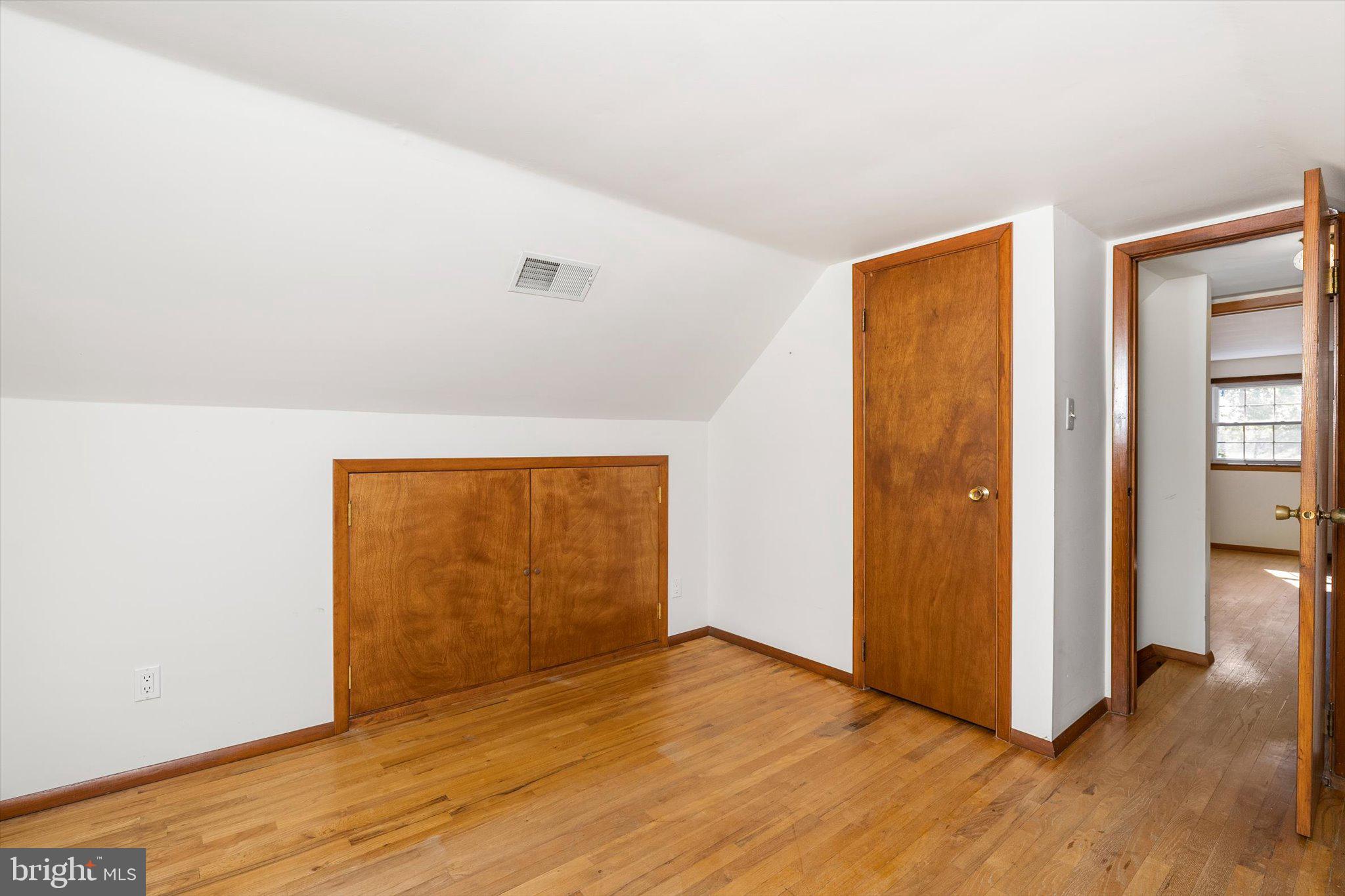 3 Applegate Lane New Egypt, NJ 08533 - Photo 19 of 38 a view of an empty room with wooden floor and a window