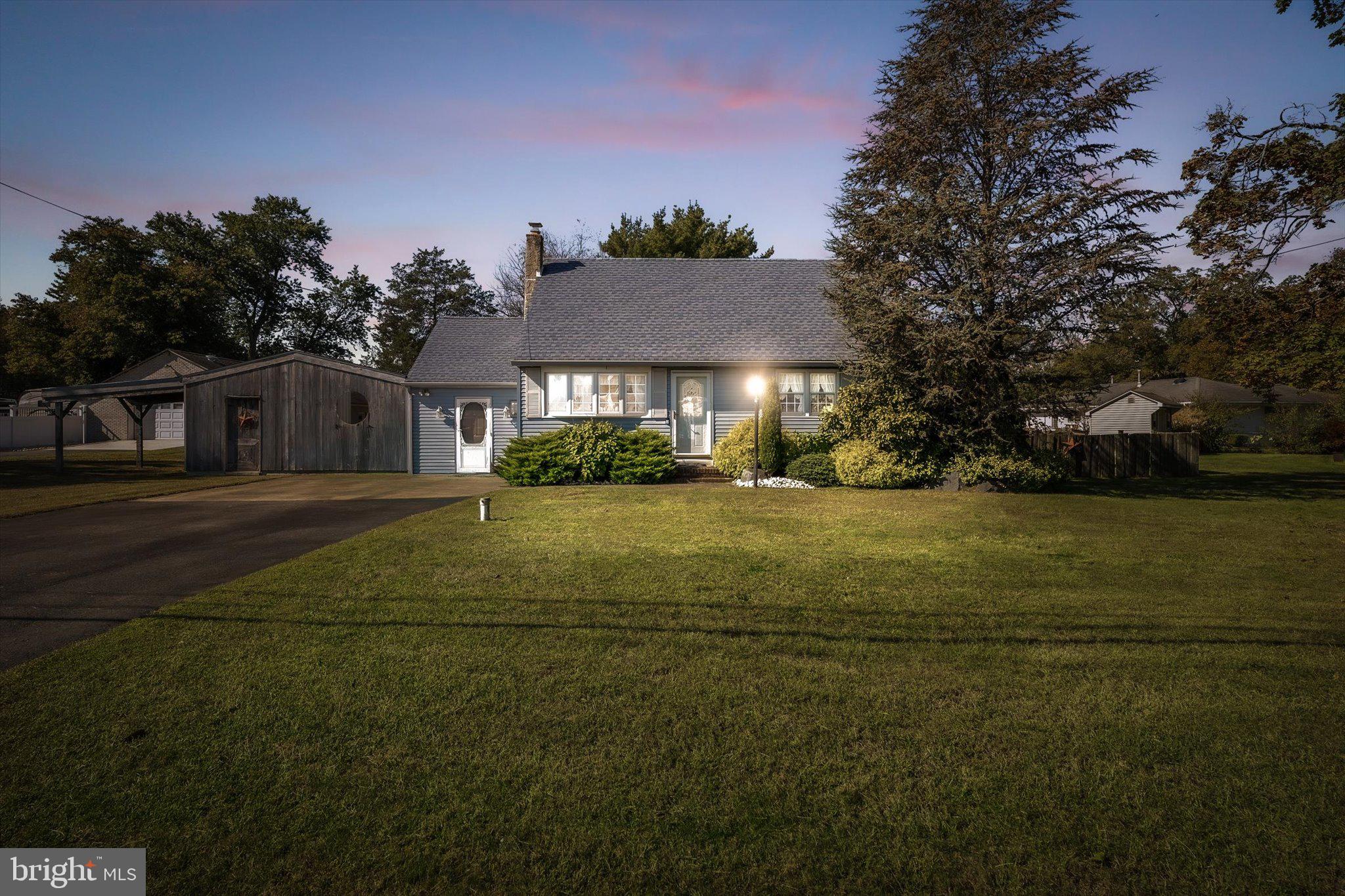 3 Applegate Lane New Egypt, NJ 08533 - Photo 2 of 38 a front view of a house with a yard