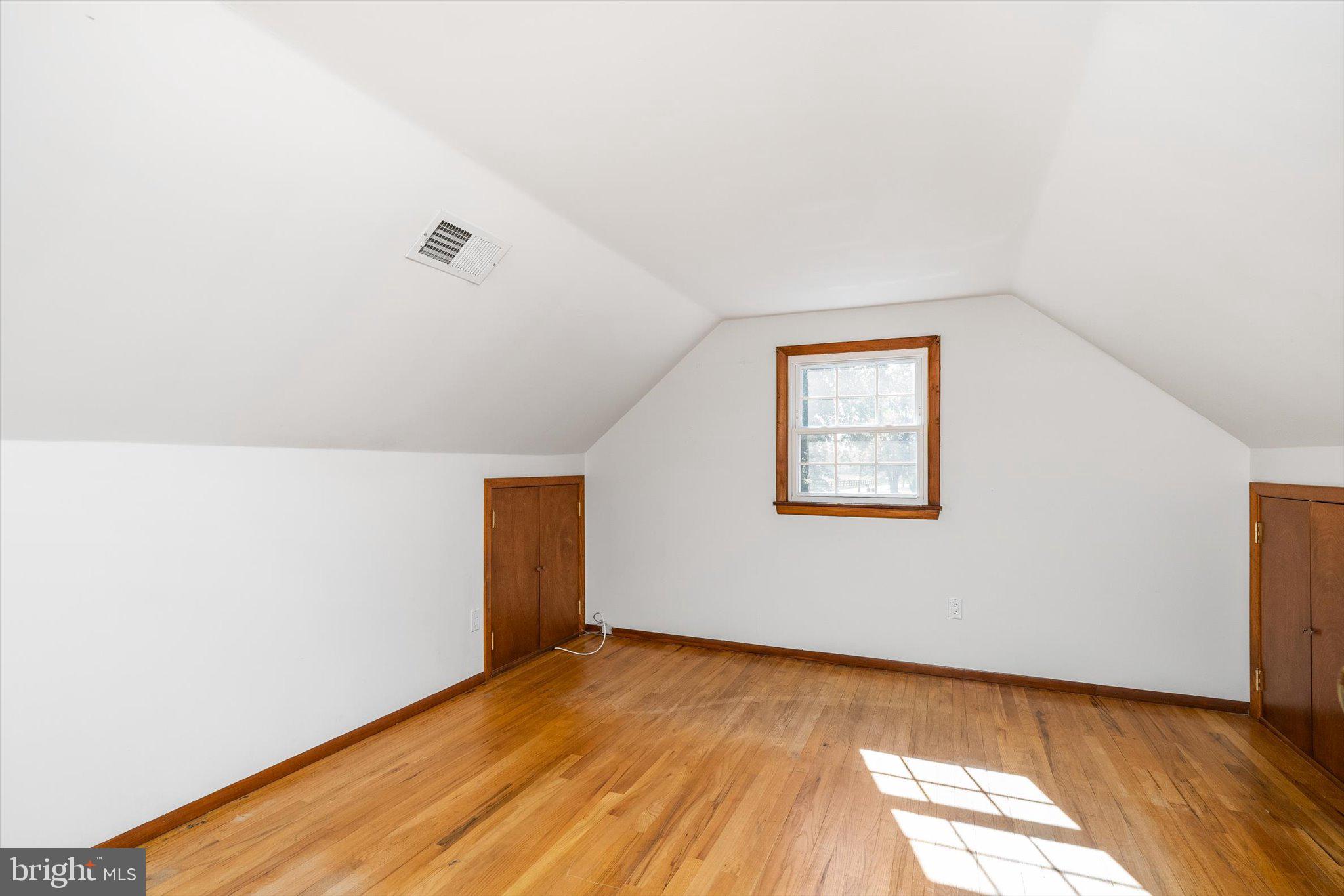 3 Applegate Lane New Egypt, NJ 08533 - Photo 21 of 38 a view of an empty room with wooden floor and a window