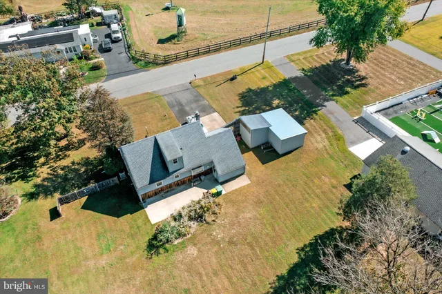 an aerial view of residential houses with outdoor space