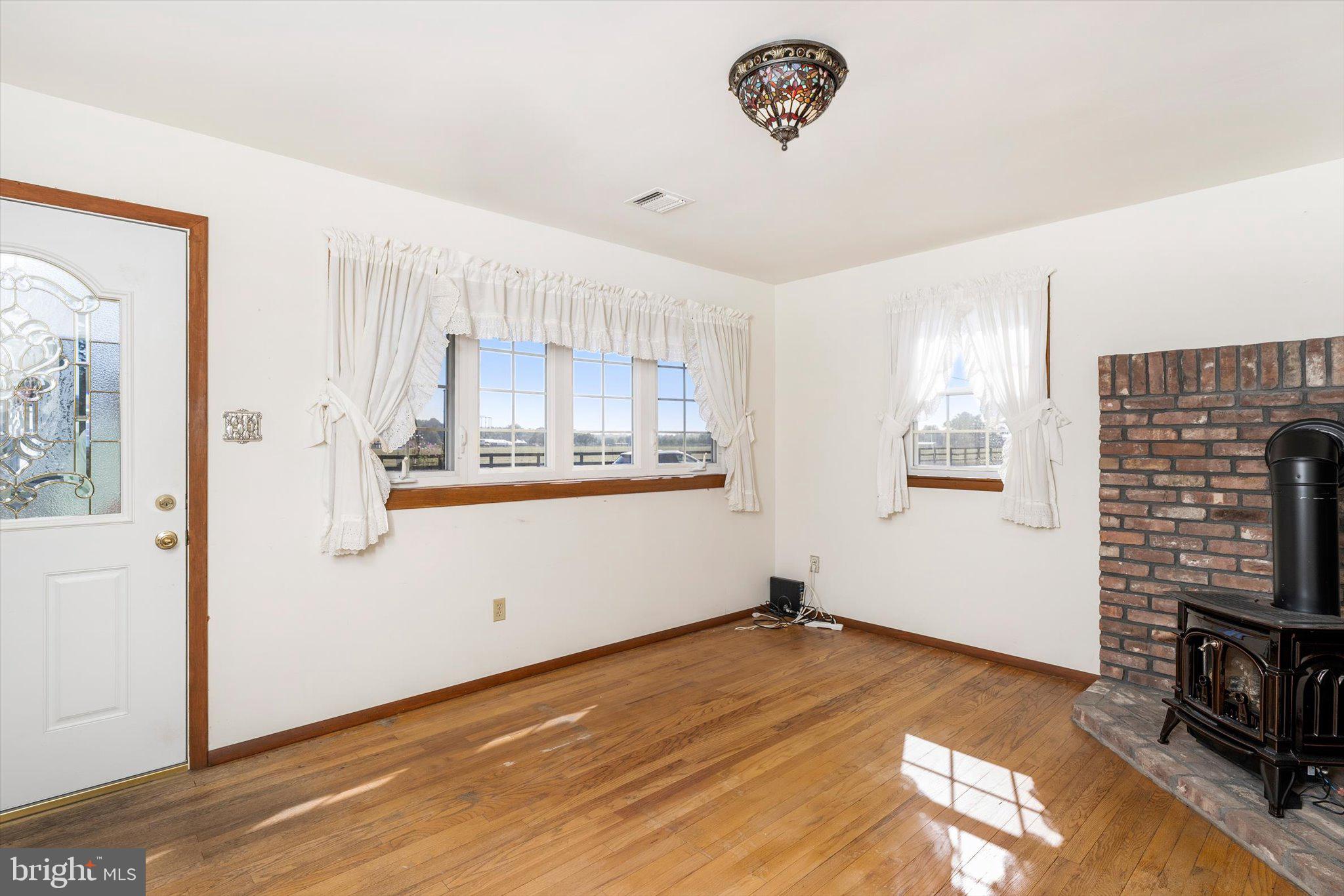 3 Applegate Lane New Egypt, NJ 08533 - Photo 5 of 38 a view of a kitchen with wooden floor and a window
