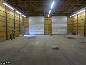 10686 Common Street East Rochester, OH 44625 - Photo 11 of 12 Garage featuring a carport