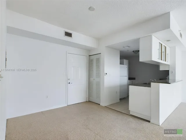 a kitchen with granite countertop a stove and a sink