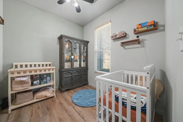 a bedroom with furniture and a window