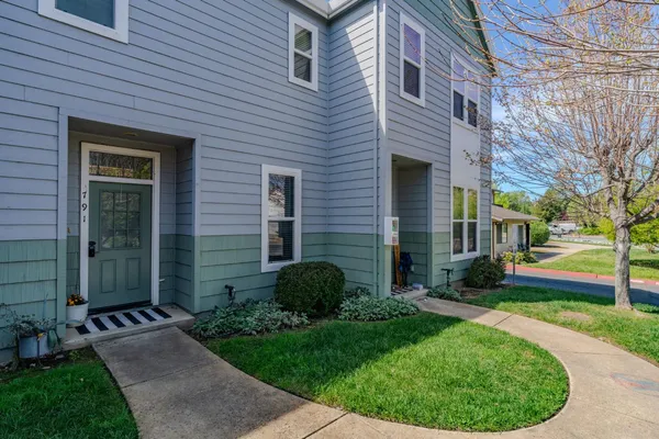 a view of a house with a backyard