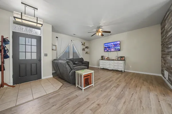 a view of a livingroom with furniture and stairs