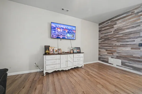 a room with furniture and wooden floor