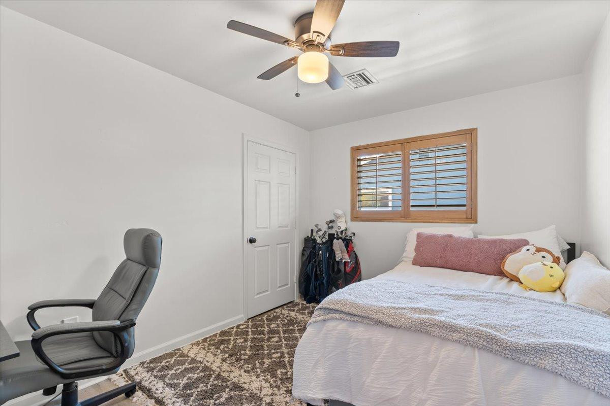 535 West 19th Street Tempe, AZ 85282 - Photo 11 of 20 a bedroom with a bed and a chair