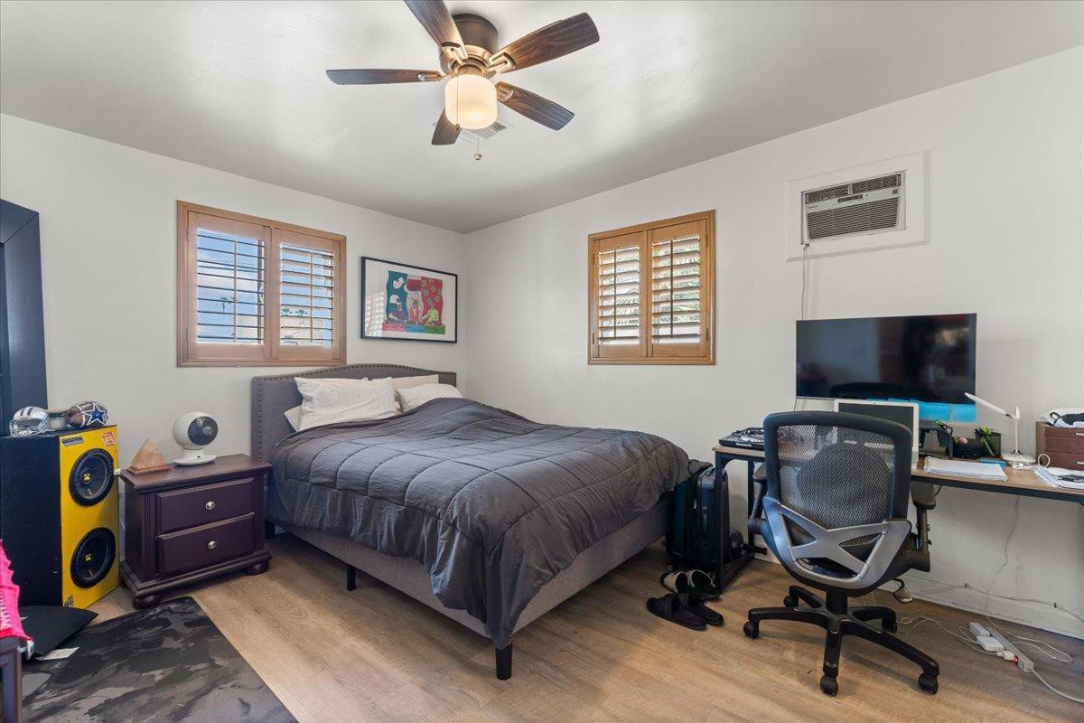 535 West 19th Street Tempe, AZ 85282 - Photo 16 of 20 a bedroom with a bed a computer on a desk and chair