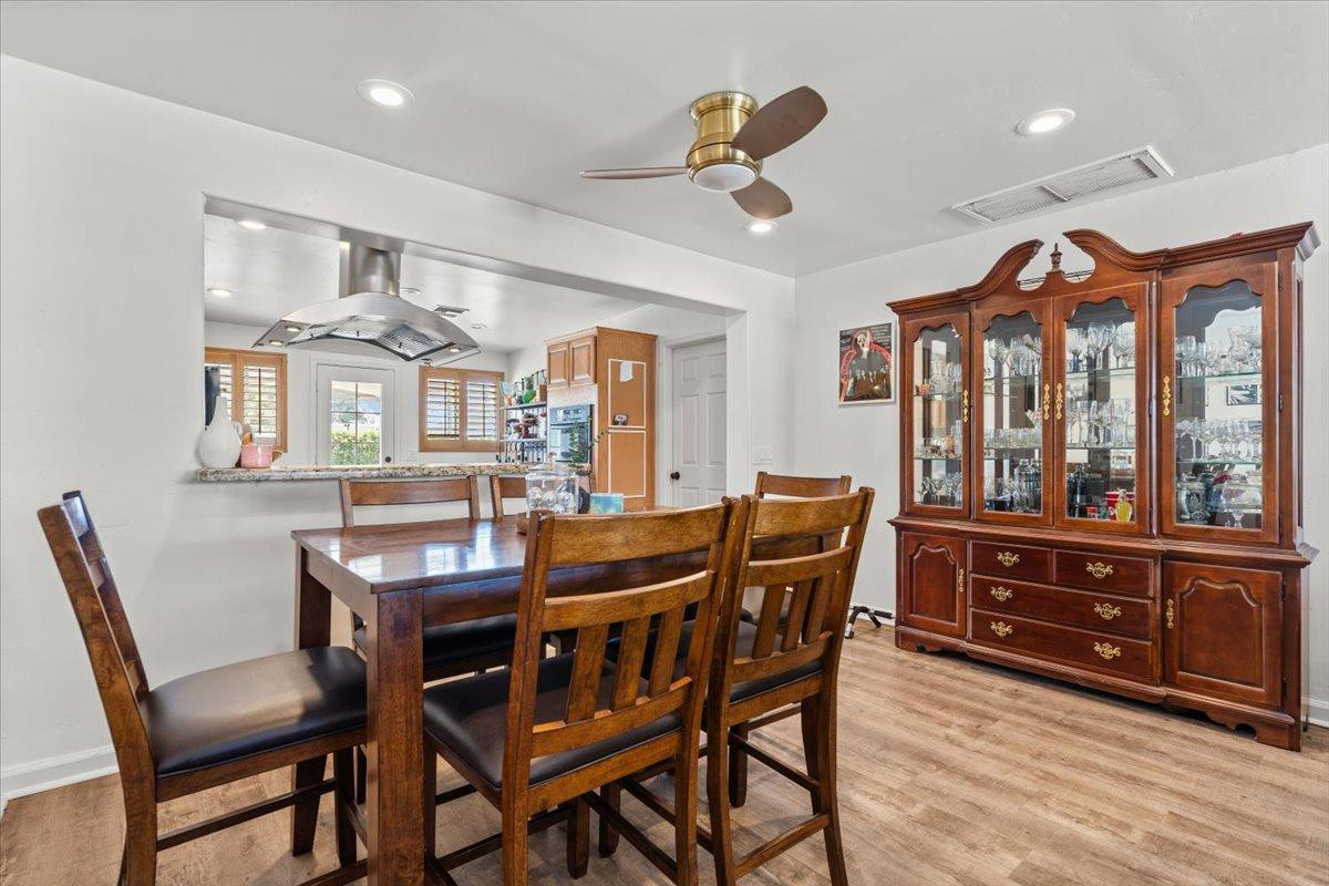 535 West 19th Street Tempe, AZ 85282 - Photo 6 of 20 a view of a dining room with furniture window and wooden floor
