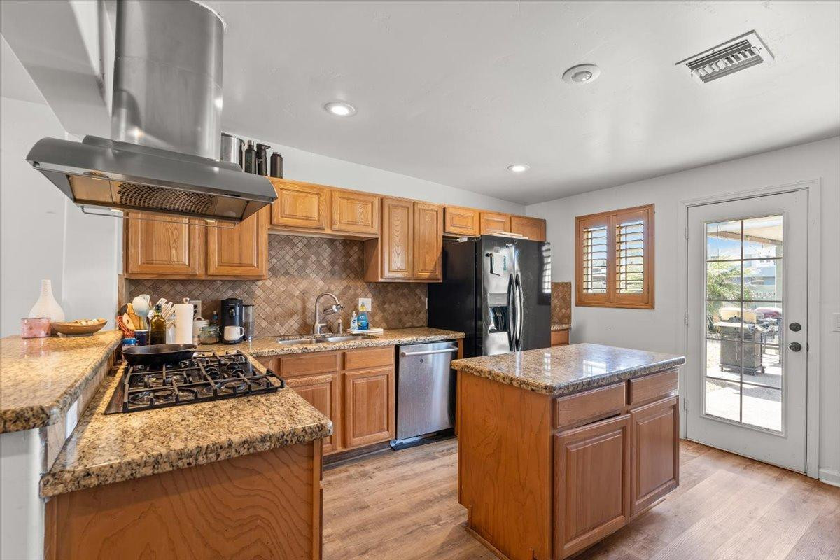 535 West 19th Street Tempe, AZ 85282 - Photo 7 of 20 a kitchen with stainless steel appliances granite countertop sink stove and refrigerator