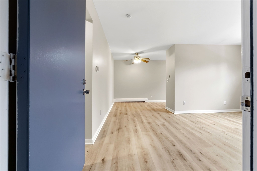 6 Venice Street, Unit B6 Danvers, MA 01923 - Photo 1 of 19 a view of an empty room with wooden floor
