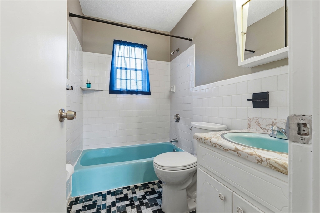 6 Venice Street, Unit B6 Danvers, MA 01923 - Photo 12 of 19 a bathroom with a sink toilet and shower